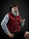 Dramatic portrait of senior smoking tobacco pipe Royalty Free Stock Photo