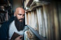 Dramatic portrait of tired bearded hipster man in stress