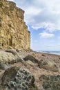 Dramatic portrait view of cliffs at West Bay, Dorset Royalty Free Stock Photo