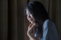 Dramatic portrait of young sad and depressed Asian Japanese woman crying desperate broken heart suffering depression and anxiety Royalty Free Stock Photo