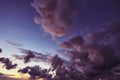 Dramatic purple clouds during sunset after a thunderstorm Royalty Free Stock Photo