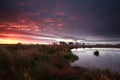 Dramatic purple sunrise over river