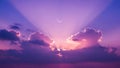 Dramatic purple twilight sky with crescent moon and sunrays through vivid clouds Royalty Free Stock Photo