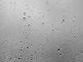 Dramatic rain drops of water on the window glass background Royalty Free Stock Photo