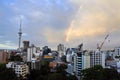 Dramatic rainbow in a rain cloud over Auckland skyline