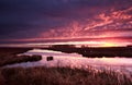 Dramatic red fire sunrise over river