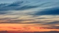 Dramatic red and orange sky and clouds. Red-orange clouds at sunset sky. Warm weather background. Art photo of the sky at dusk. Royalty Free Stock Photo