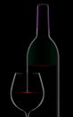 A dramatic rim light outlines a bottle and glass of red wine Royalty Free Stock Photo
