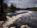 The dramatic River Wharfe in full flow Royalty Free Stock Photo