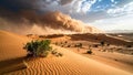 Dramatic sandstorm sweeping across desert dunes under a cloudy sky Royalty Free Stock Photo