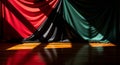 Dramatic satin drapery in red black and green light Royalty Free Stock Photo