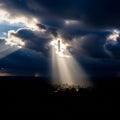 Dramatic scene with sunbeams piercing through dark, heavy clouds, Royalty Free Stock Photo
