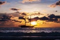 Dramatic sea and transport boat in color of sunset Royalty Free Stock Photo