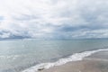 Dramatic seascape in dark colors. Dark sky with clouds over the stormy sea. Royalty Free Stock Photo