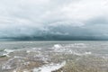 Dramatic seascape in dark colors. Dark sky with clouds over the stormy sea. Royalty Free Stock Photo