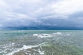 Dramatic seascape in dark colors. Dark sky with clouds over the stormy sea. Royalty Free Stock Photo