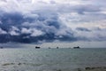 Dramatic seascape in dark colors. Dark sky with clouds over the stormy sea. Royalty Free Stock Photo