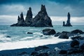 Dramatic seascape of Reynisdrangar cliffs in the Atlantic ocean