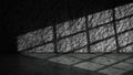 Dramatic shadow of window light shines across the interior of the room with a gray wall and floor background. Mockup, copy space, Royalty Free Stock Photo
