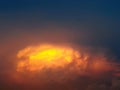 Dramatic shape and color clouds in the evening dawn, sunset, cloudscape, skyscape, dark blue sky, reflection of sunlight, nature