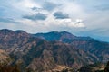 Dramatic shot of mountains and cloudy sky in the background, nature concept