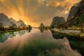 Limestone karst mountains in Yangshuo County with the scene reflected in the river