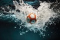 dramatic shot of water polo ball splashing into the pool