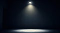 Dramatic single spotlight illuminating a dark empty stage or room Royalty Free Stock Photo