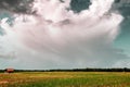 Dramatic sky above green field Royalty Free Stock Photo