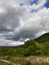 Dramatic sky behind a mountain landscape, big grey clouds Royalty Free Stock Photo