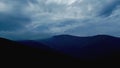 Dramatic sky in blue-gray tones over the mountains. Almost black mountains and blue-gray, cloudy skies. Stormy skies Royalty Free Stock Photo