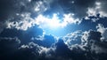 Dramatic sky with bright sunlight breaking through dark, fluffy clouds. Royalty Free Stock Photo