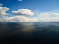 Dramatic sky with clouds above the blue lake or river before the rain Royalty Free Stock Photo