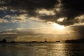 Silhouette of sailboat with Dramatic sky in a tropical sunset. Royalty Free Stock Photo