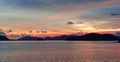 Dramatic sky clouds sunset twilight sky with mountain or island reflex on the sea Royalty Free Stock Photo