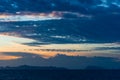 Dramatic sky with dark clouds above the sea at sunset. Royalty Free Stock Photo