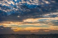 Dramatic sky with dark clouds above the sea at sunset. Royalty Free Stock Photo