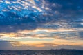 Dramatic sky with dark clouds above the sea at sunset. Royalty Free Stock Photo