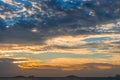 Dramatic sky with dark clouds above the sea at sunset. Royalty Free Stock Photo