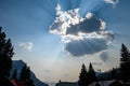 Dramatic sky with the evening sun spearing through clouds in a mountain town, Wyoming, USA Royalty Free Stock Photo