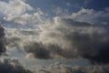 A dramatic sky featuring a mix of cumulus and nimbostratus clouds. Royalty Free Stock Photo