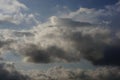 A dramatic sky featuring a mix of cumulus and nimbostratus clouds. Royalty Free Stock Photo
