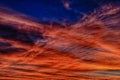 Dramatic sky with fire like cloud formations at dawn