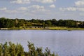 Dramatic sky, looking across the lake to the boat ramp and parking lot. Royalty Free Stock Photo