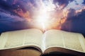 Dramatic sky with open Bible Royalty Free Stock Photo