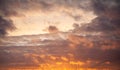 Dramatic sky with orange clouds over the city before dawn or sunset. Royalty Free Stock Photo