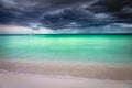 Dramatic sky over beach with motorboat, Negril Seven Mile Beach, Jamaica Royalty Free Stock Photo