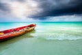 Dramatic sky over beach with motorboat, Negril Seven Mile Beach, Jamaica Royalty Free Stock Photo