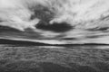 Dramatic sky over beautiful calm water and beach in Gulf of Bothnia. Storsand, High Coast in northern Sweden. Black and white Royalty Free Stock Photo