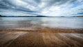 Dramatic sky over beautiful calm water in Gulf of Bothnia. Storsand, High Coast in northern Sweden Royalty Free Stock Photo